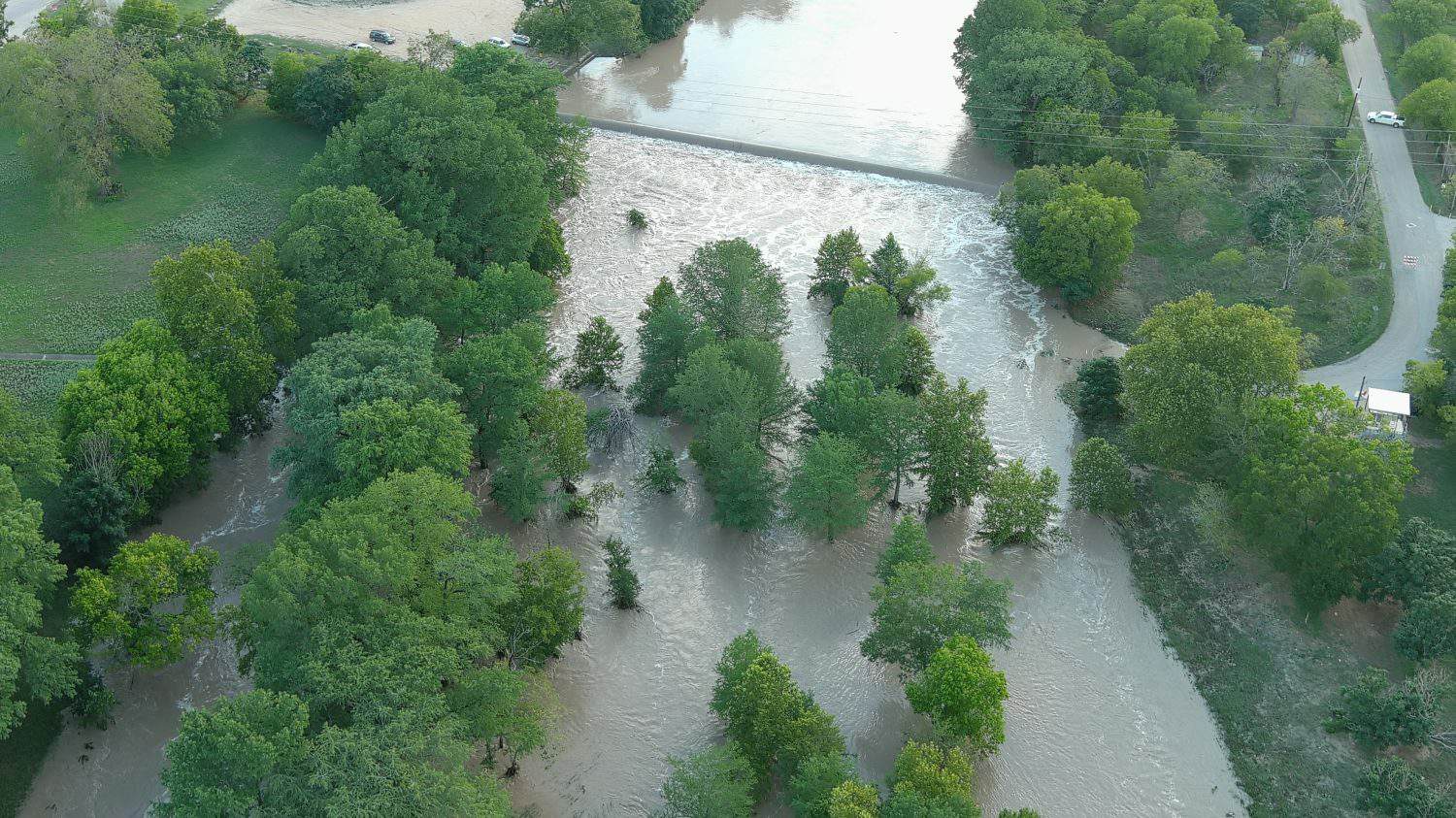 Showing the flooding of the Guadalupe river at a low water crossing in Center Point Texas. The river is about 7 ft above normal. 