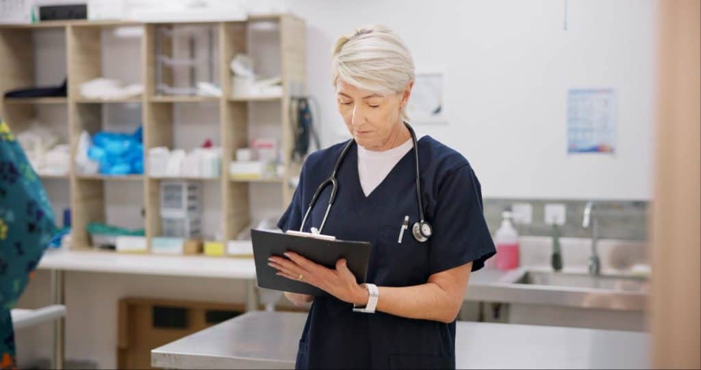 Veterinarian, checklist and inventory for prescription, surgery and medicine for vaccination, animal or health. Mature woman, chart and veterinary office for pet care, checkup or diagnosis in clinic
