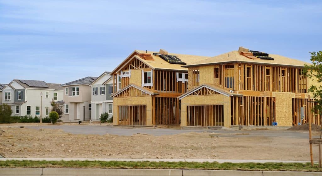Homes under construction with completed homes