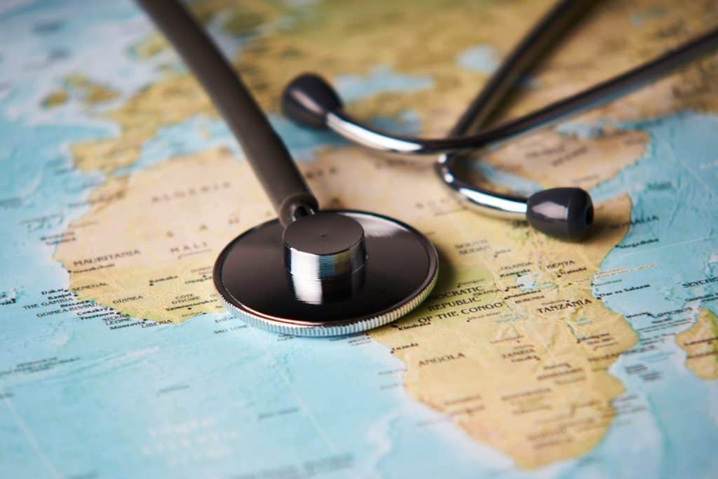 Doctor's medical stethoscope over africa healthcheck. Medical concept tourism travel care diseases healthy, close-up. Selective focus
