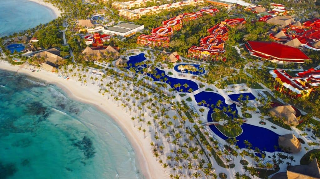 Barcelo Maya Beach Scene, A beautiful seaside Beach and Reflections in Wet Sand with Breaking Waves, Tranquil beach scene. Exotic tropical beach landscape for background or wallpaper.