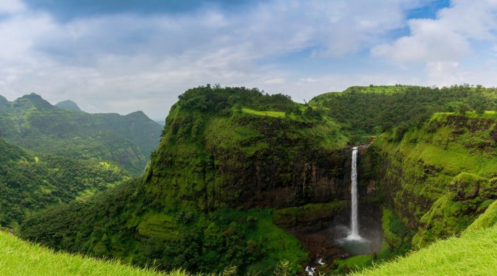Beautiful waterfall with dramatic sky, somewhere in the Sahyadri ranges of western ghats of Maharashtra