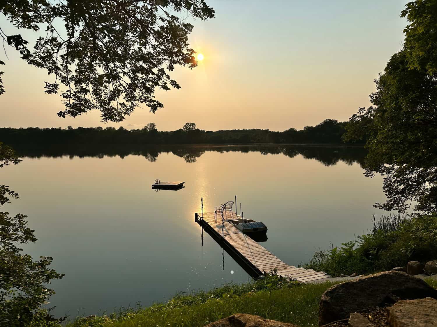 Minnesota lake with dock at sunset