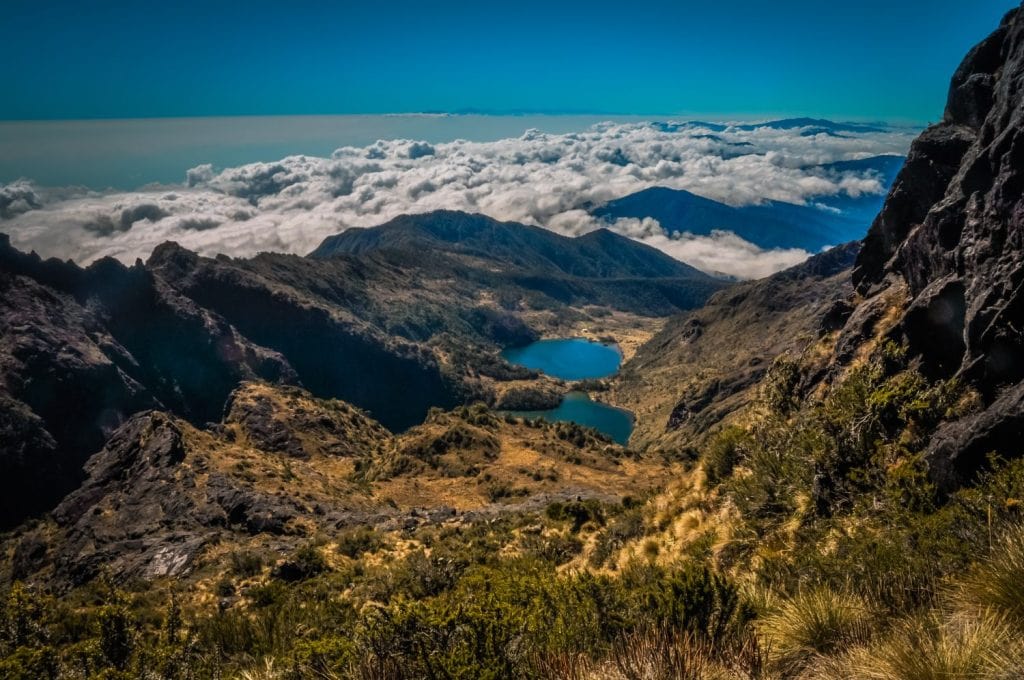 Lake and mountains covered by morning fog on Mount Wilhelm, Papua New Guinea. This is very remote location, rarely visited by people.
