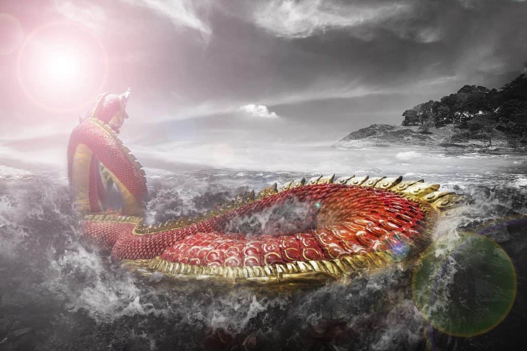 The red naga is swimming in the stormy sea.