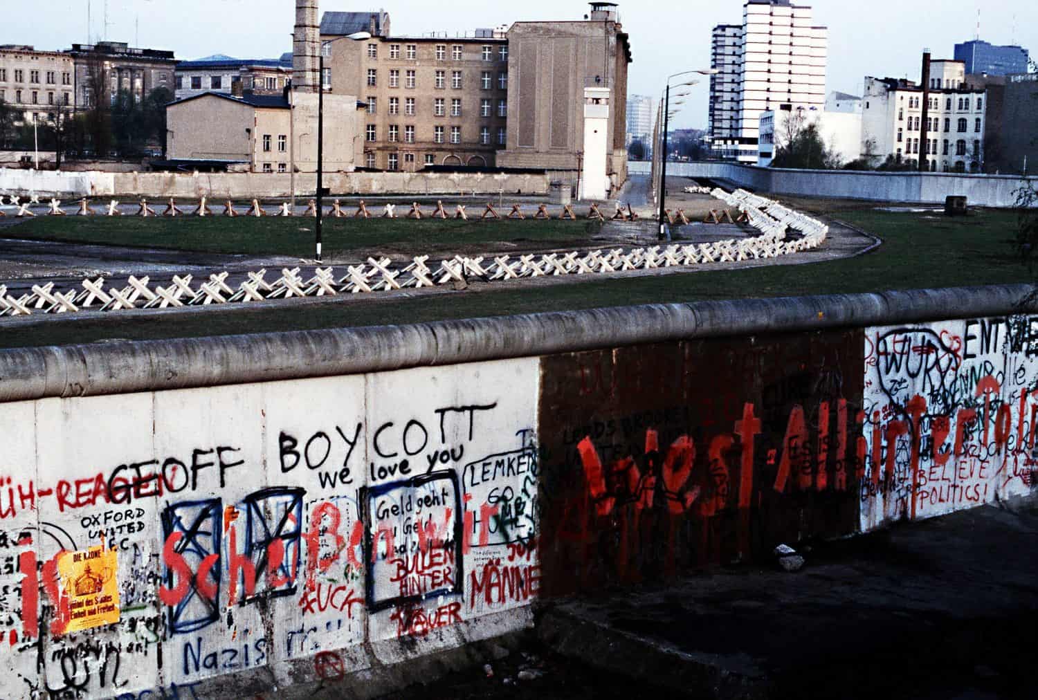 The Berlin Wall separated Communist-controlled East Germany from West Berlin. White apartments of West Berlin contrast with the boarded up vacant brick buildings of East Berlin. June 1 1983.