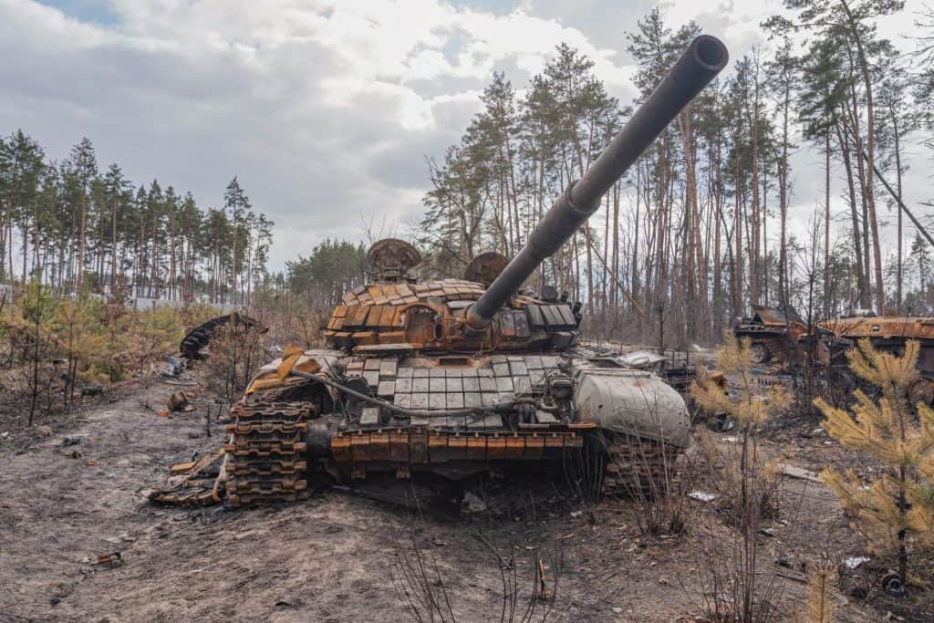 The destroyed tank stands at the scene of hostilities. War in Ukraine (war concept)