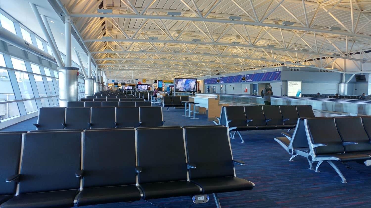 airport waiting rooms, lounges with glass windows, chairs and airplanes jfk