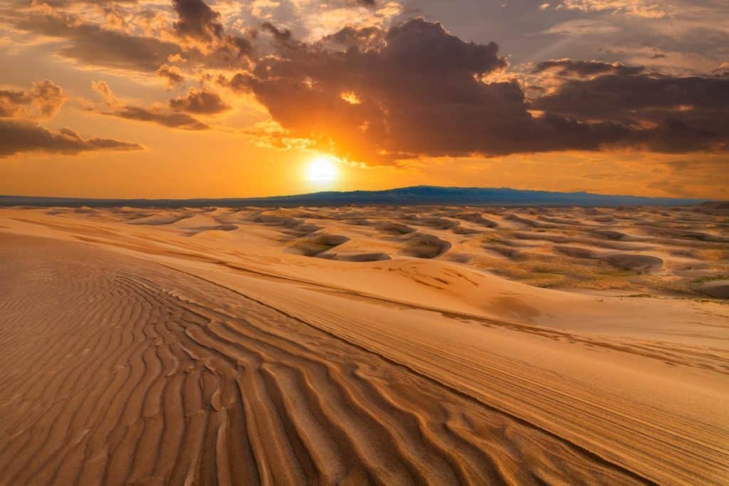Sunset over the sand dunes in the desert. Sahara desert