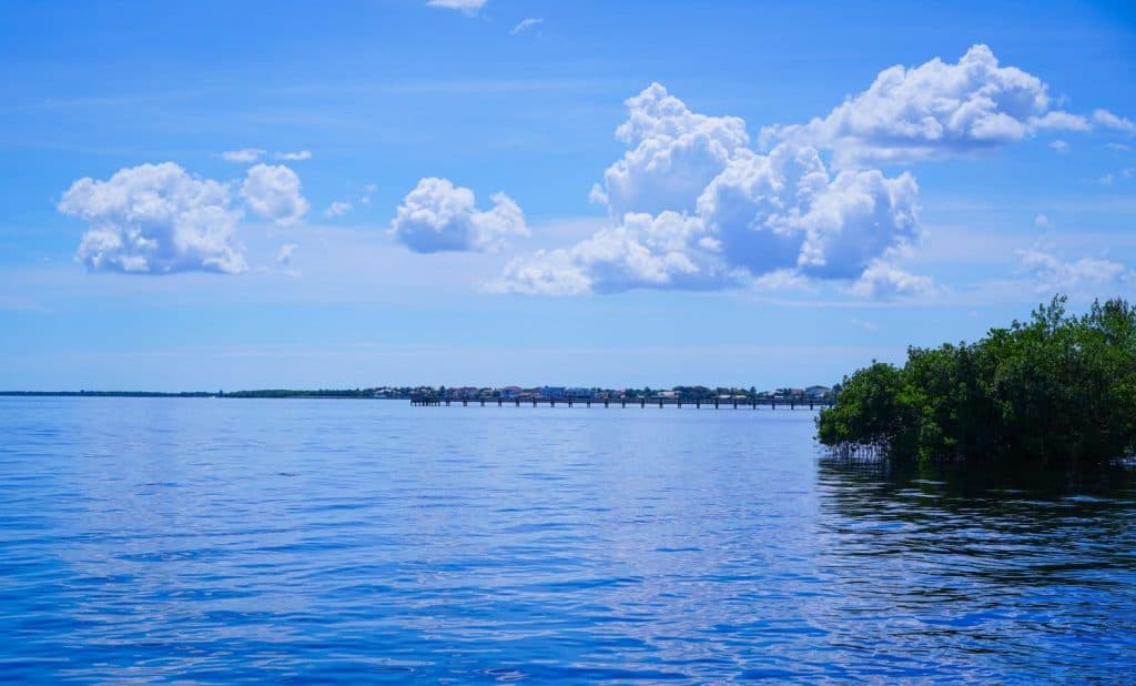 A look out over Charlotte Harbor with its calm waters and deep blue skies and plenty of fishermen.