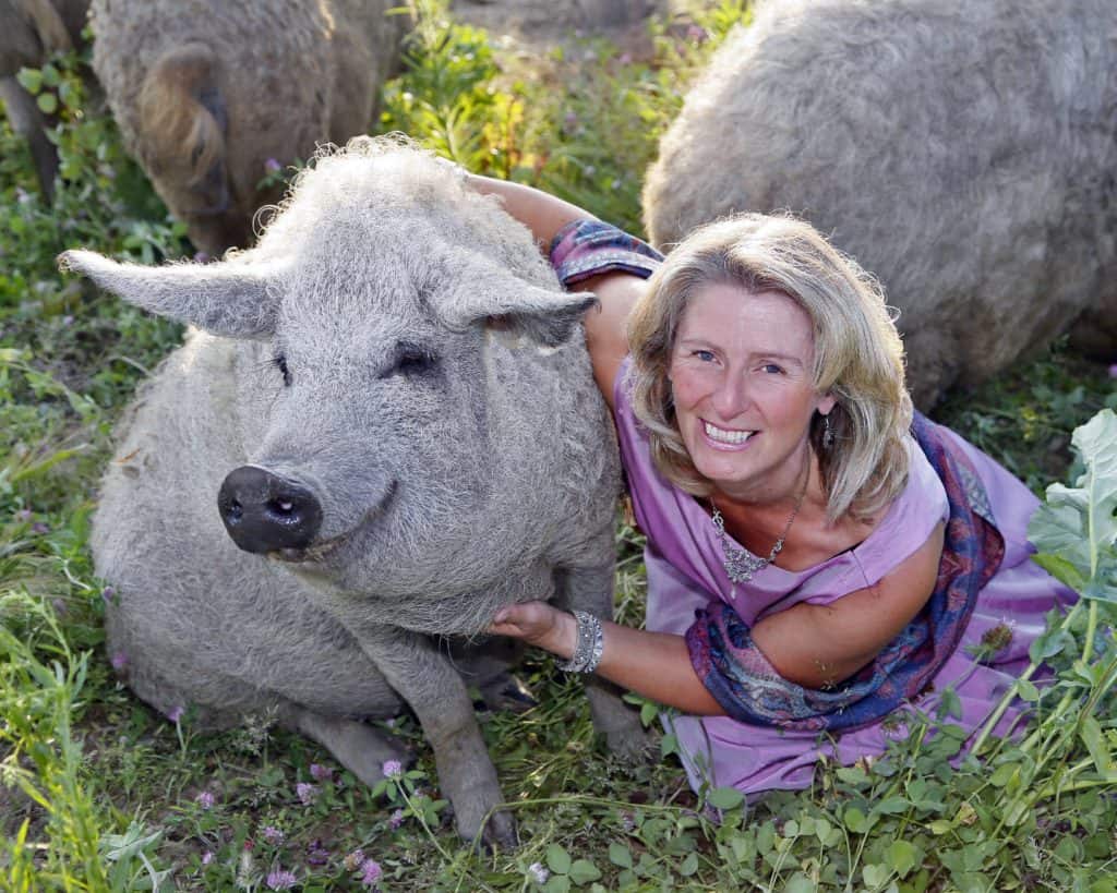 Barbara Meyer zu Altenschildesche of Royal Mangalitsa USA with her pigs
