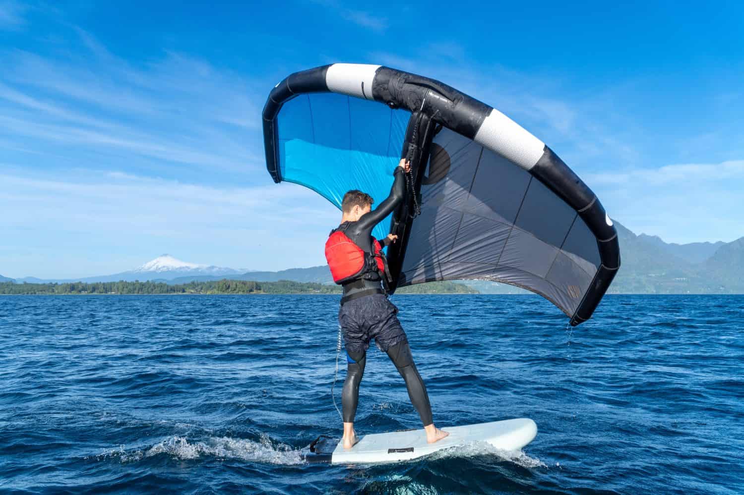 Teenager enjoying practicing summer water sports in the lake