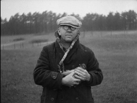 Alfred Otto Gross holding Booming Ben, the last known heath hen.
