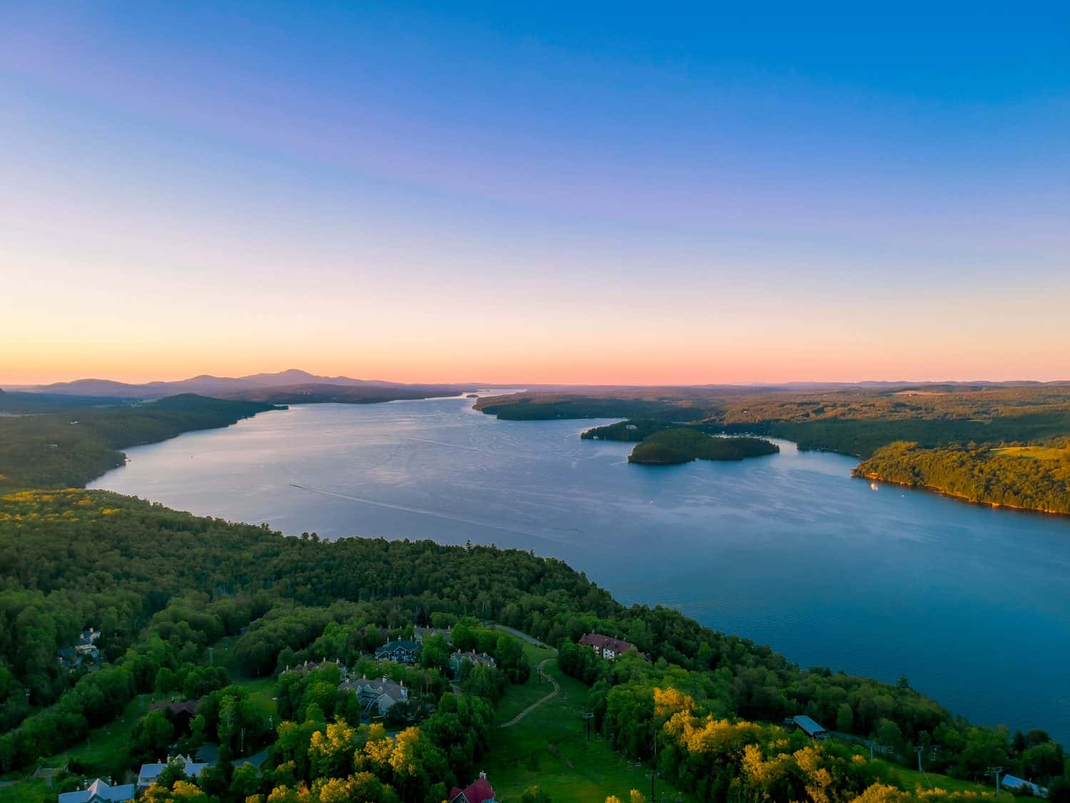 Aerial view of the lake Memphremagog on a beautiful sunset taken with a drone