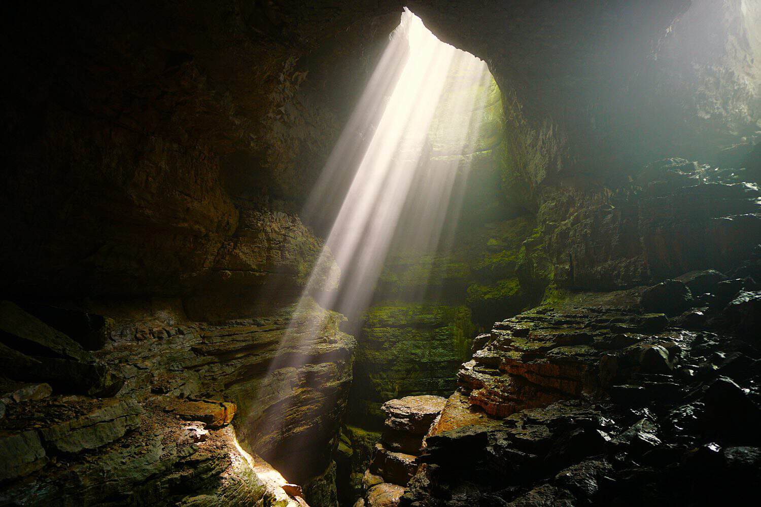 Light Beams illuminating the Stephens Gap  Cave Alabama