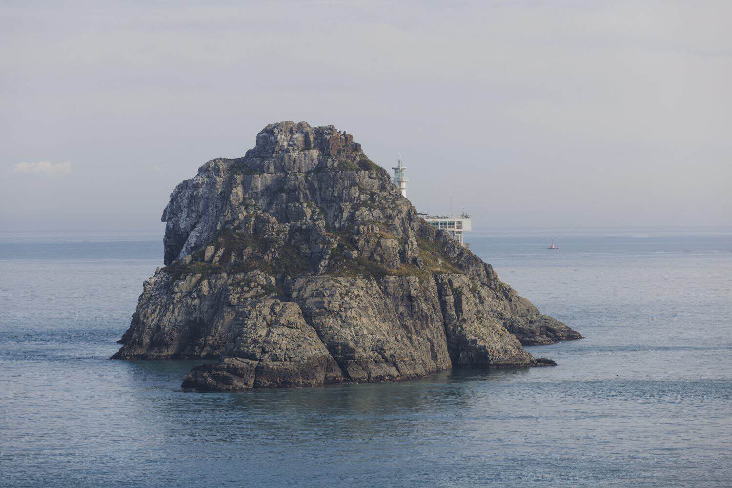 Oryukdo Islands with Lighthouse, Busan, South Korea, Deungdaeseom island Lighthouse, Busan Bay, Yongho-dong, Nam District, sunny spring day landscape during yacht boat tour cruise, Korean Strait