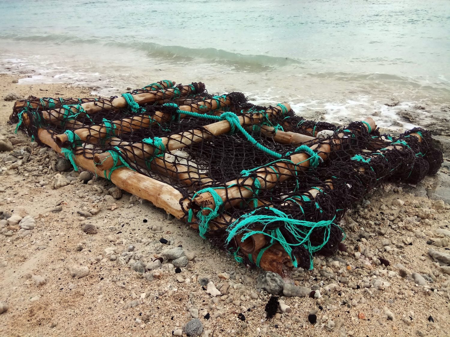 A fish aggregating device washed up onto the beach after stormy seas on Rarotonga, Cook Islands