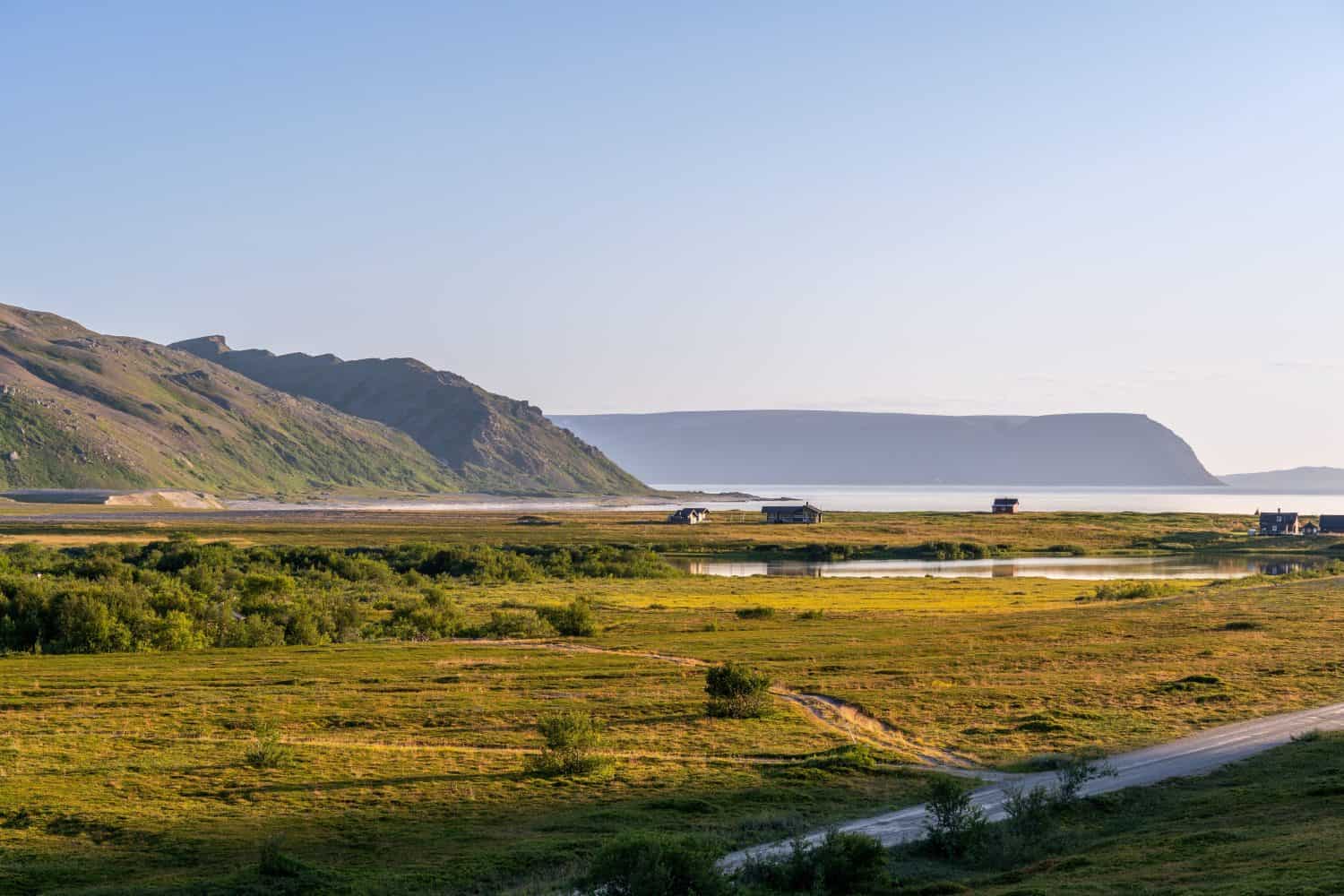 Picturesque landscapes of Northern Norway near Molvik, Finnmark, Norway with mountains, lake and fjords around